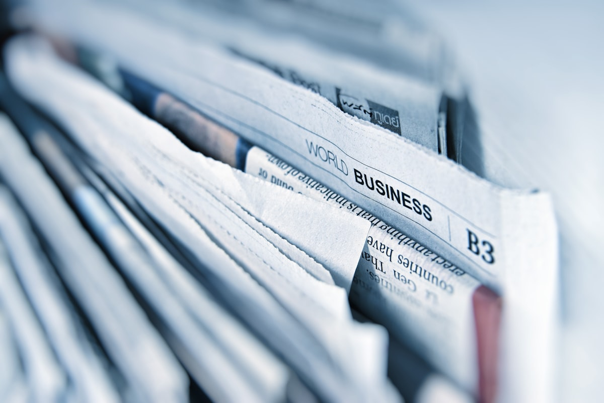 Newspaper and coffee on desk